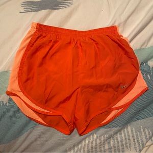 Orange Nike shorts